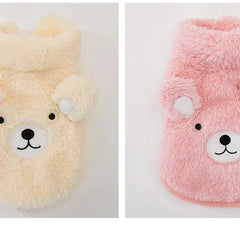 The Dog Face Cute Bear Dog Fur Coat in yellow and pink, displayed flat on a surface.