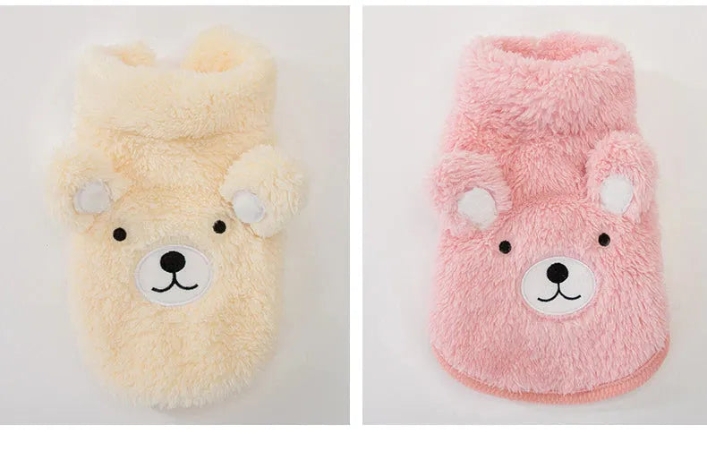 The Dog Face Cute Bear Dog Fur Coat in yellow and pink, displayed flat on a surface.