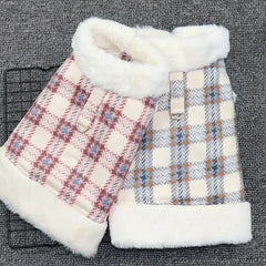 Two plaid dog coats in pink and blue colors with white fleece lining, displayed on a grey background