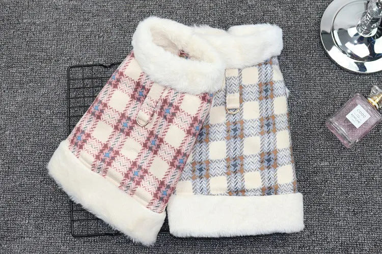 Two plaid dog coats in pink and blue colors with white fleece lining, displayed on a grey background