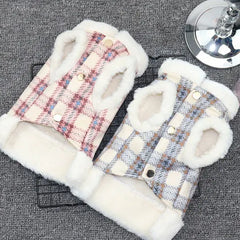 Front view of two plaid dog coats in pink and blue with white fleece lining, displayed on a grey background