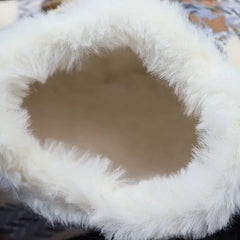 Detail view of the soft white fleece lining on a blue plaid dog coat