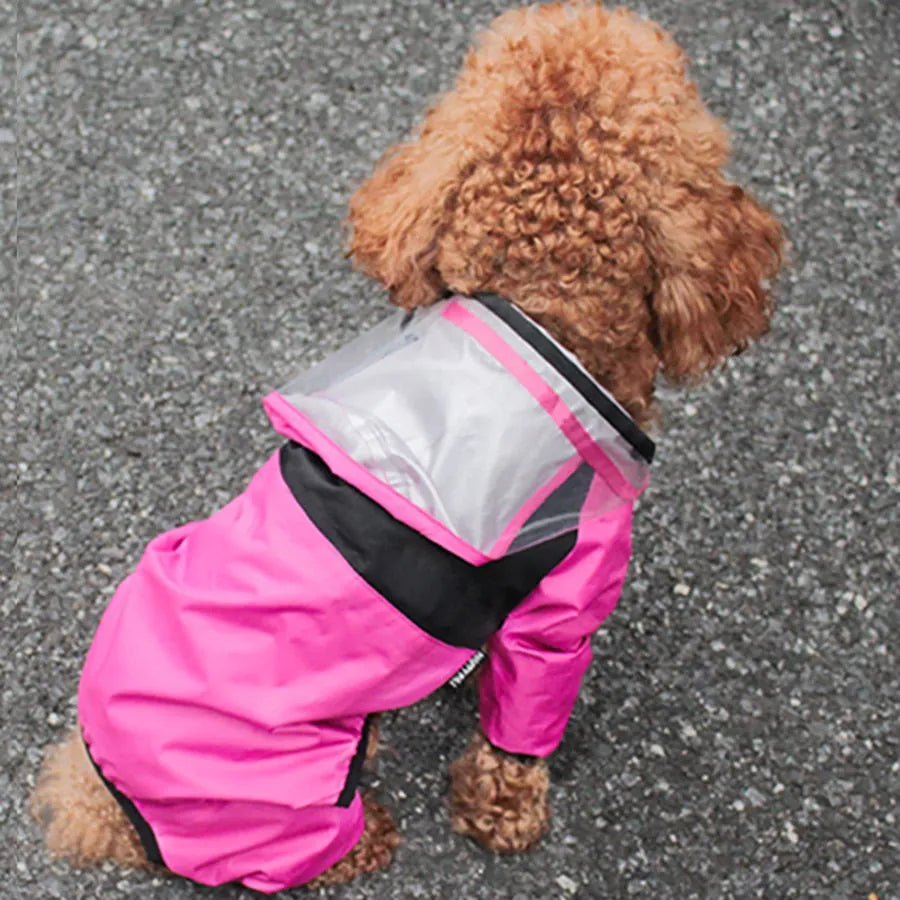 Dog Raincoat With Legs in pink featuring a transparent hood, perfect for keeping your dog dry and stylish.