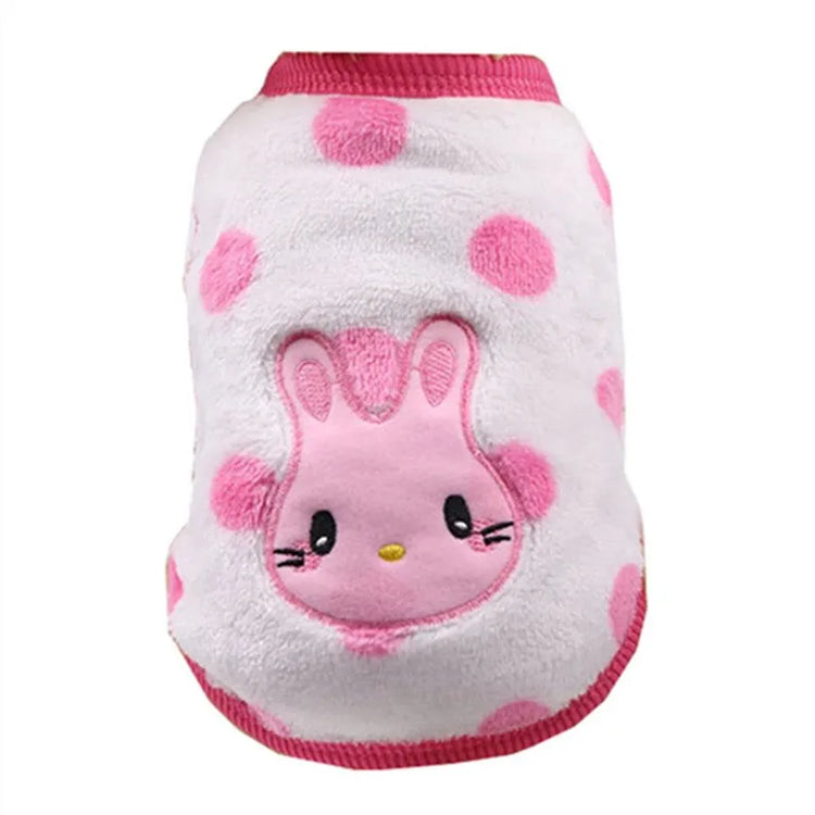 Very small dog sweater with white and pink polka dots, featuring an embroidered pink rabbit on the back.