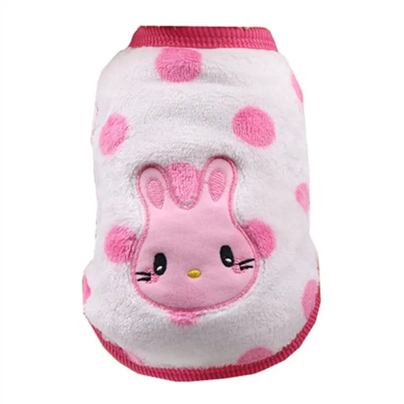 Very small dog sweater with white and pink polka dots, featuring an embroidered pink rabbit on the back.