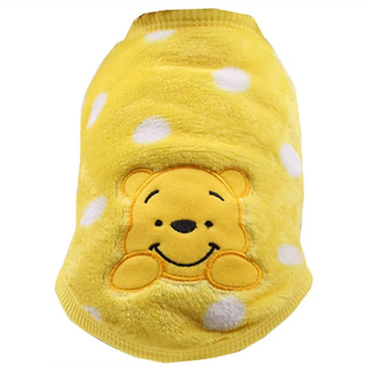 Very small dog sweater in yellow with white polka dots, featuring an embroidered smiling bear face on the back.