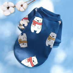 Designer Dog Coat featuring cute polar bears with scarves on a blue background, ideal for winter fashion.