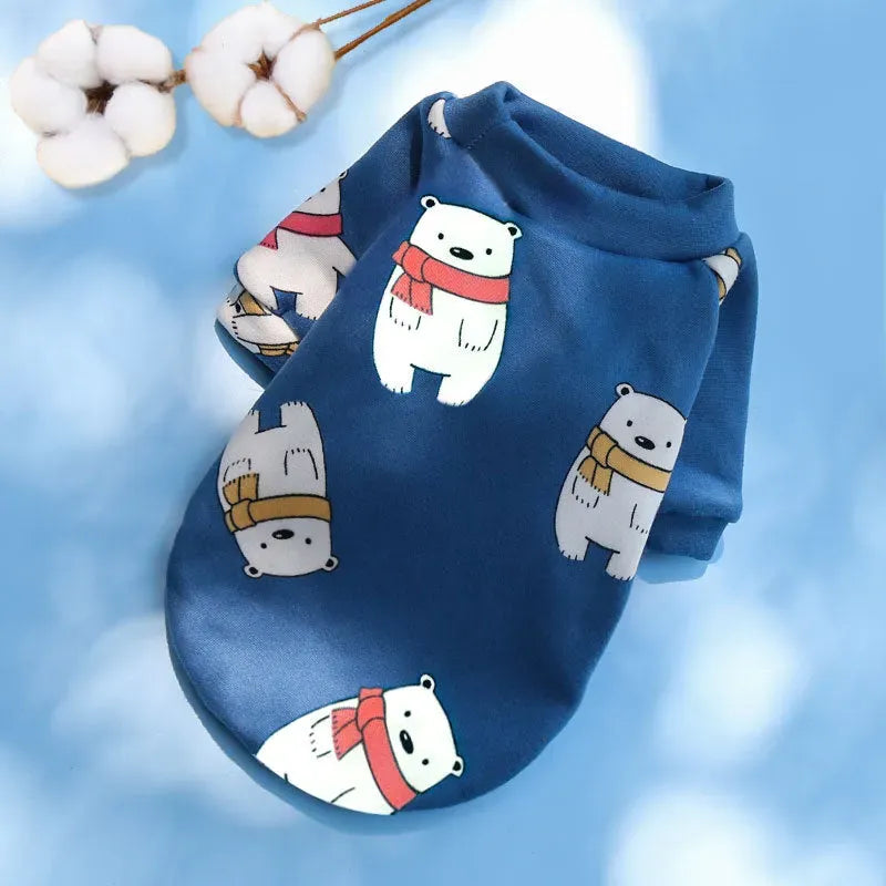 Designer Dog Coat featuring cute polar bears with scarves on a blue background, ideal for winter fashion.