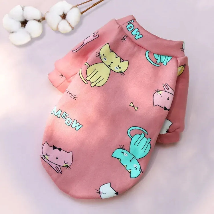 Designer Dog Coat in pink featuring multiple cat designs, perfect for a cute and whimsical style.