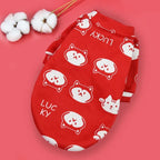 Designer Dog Coat in red with cat faces and 'Lucky' text, perfect for adding a vibrant and charming touch to your dog's wardrobe.