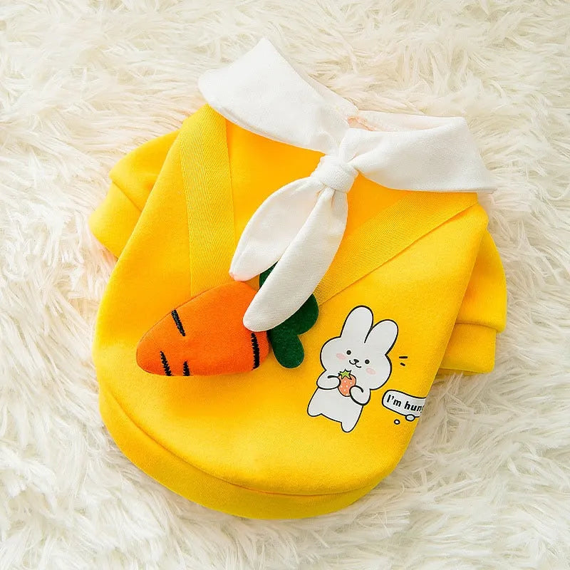 Yellow sweater with a carrot design and white collar, featuring a cute rabbit graphic, perfect Designer Dog Sweaters."