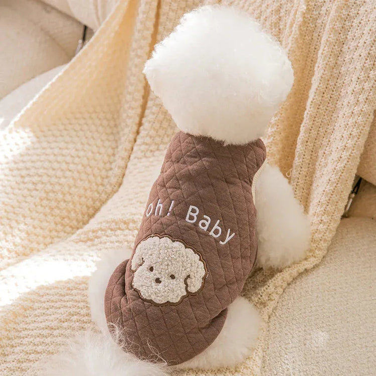 Dog wearing a brown quilted 'Oh! Baby' sweater with a cute embroidered dog face, perfect for a Dog Thanksgiving Sweater."