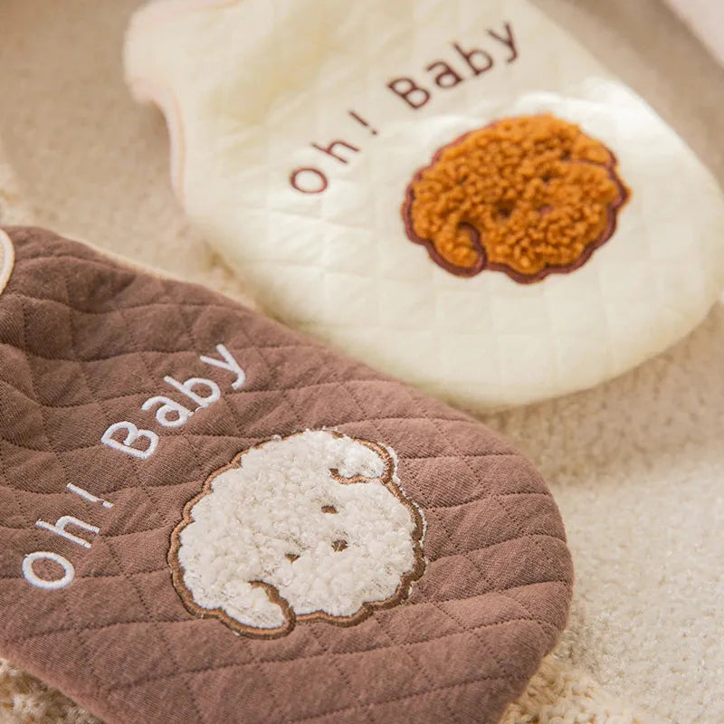 "Close-up of two 'Oh! Baby' sweaters in brown and cream with embroidered dog faces, suitable for Dog Thanksgiving Sweaters."