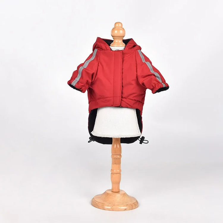 Close-up of red waterproof raincoat for dogs by "The Dog Face," showcasing high-quality pet rainwear.