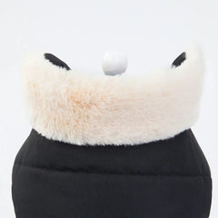 Close-up of the faux fur trim on a black fleece dog jacket, showcasing the soft and fluffy texture.