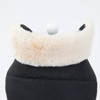 Close-up of the faux fur trim on a black fleece dog jacket, showcasing the soft and fluffy texture.