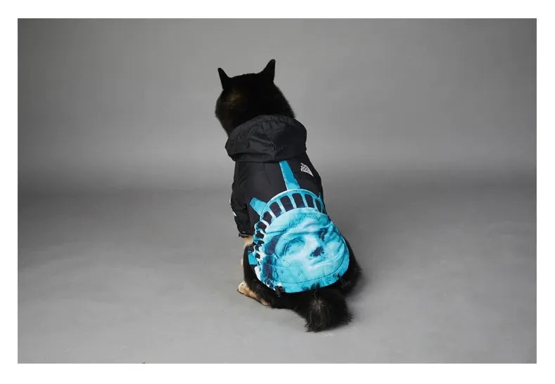 Dog wearing American Apparel Dog Hoodie in black and blue with a Statue of Liberty design, back view