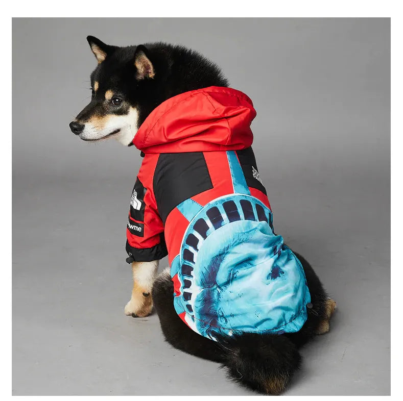 Dog wearing American Apparel Dog Hoodie in red with a Statue of Liberty design, back and side view