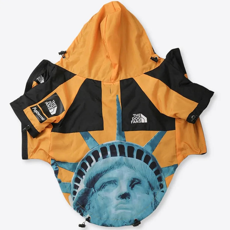 Dog wearing American Apparel Dog Hoodie in yellow with a Statue of Liberty design, side view