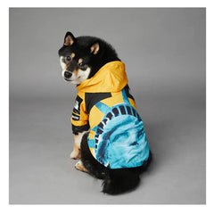 Dog wearing American Apparel Dog Hoodie in yellow with a Statue of Liberty design, side and back view