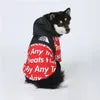 Shiba Inu dog standing sideways in a red alphabet print hoodie from "The Dog Face," stylish hoodies for dogs