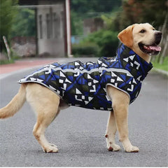 Four dogs wearing reflective waterproof dog jackets in different colors and patterns, standing on grass.