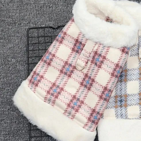 Red and blue plaid dog coats with white fleece lining displayed on a grey background