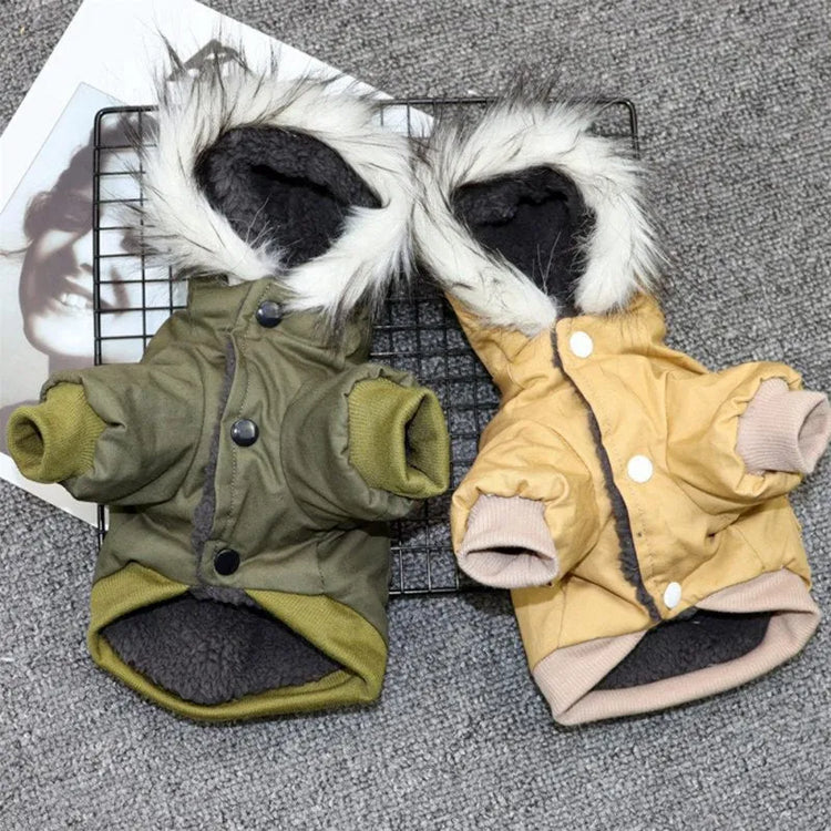 Two dog hoodies with faux fur trim, one in green and one in tan, laid flat on a gray background