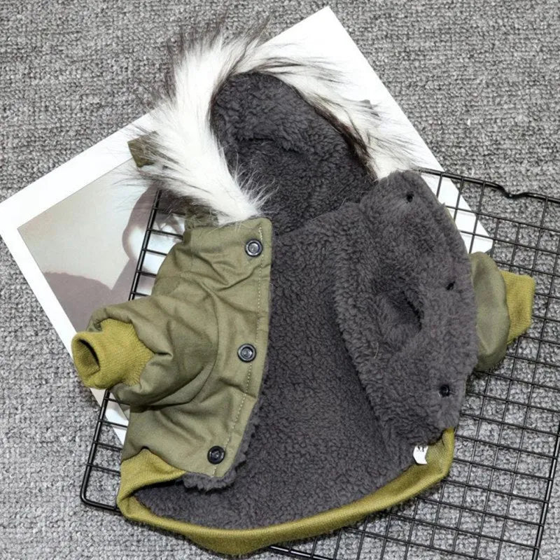 A green dog hoodie with faux fur trim, laid open showing the interior fleece lining