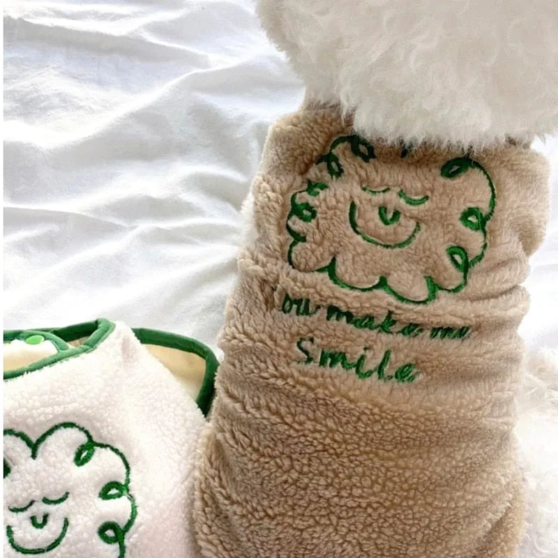 Cream embroidered dog shirt with a green smiling face design and 'You make me smile' text, ideal for an Embroidered Dog Shirt."