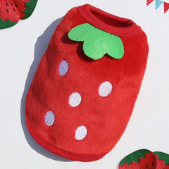 A plush red dog sweater designed to resemble a strawberry, complete with white seeds and a green leafy collar.